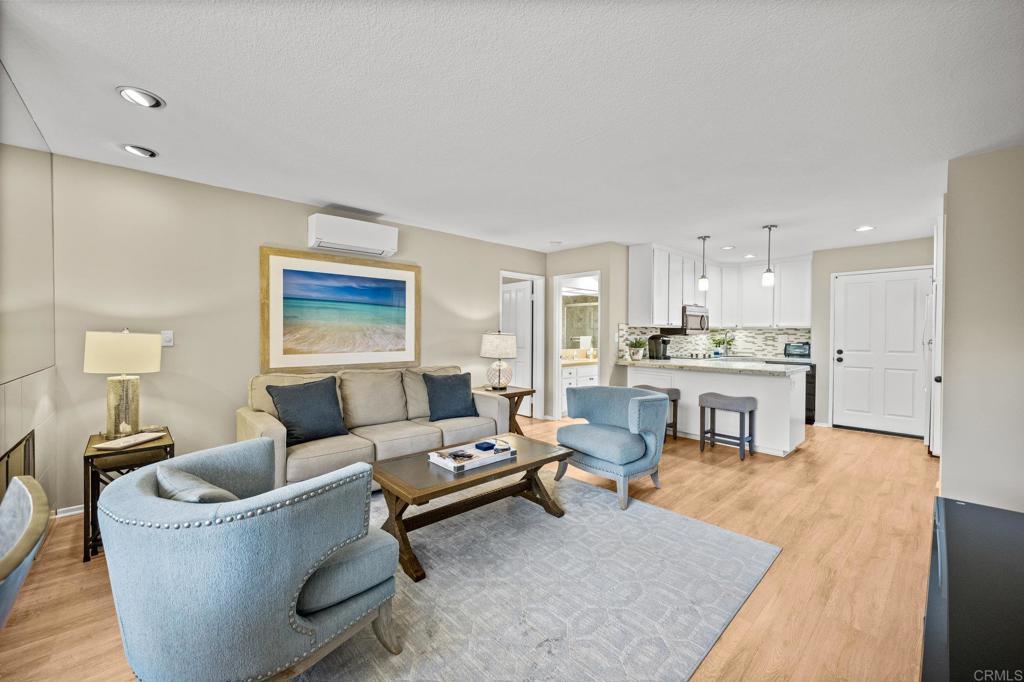 Bright living room with sliding glass door to balcony.